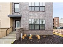 Modern brick exterior with a covered entryway and landscaping at 1224 Alabama St, Indianapolis, IN 46202