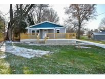 Newly built home featuring gray and blue siding, a deck, and landscaped lawn at 11365 W State Road 142, Martinsville, IN 46151