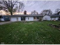 Ranch style home with attached garage and spacious lawn at 4428 N Campbell Ave, Indianapolis, IN 46226