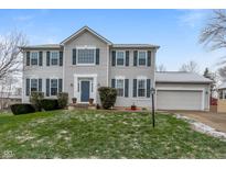 Two-story house with gray siding, blue door, and attached garage at 10802 Midnight Dr, Indianapolis, IN 46239