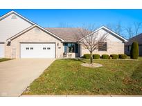 Brick ranch home with attached two-car garage and landscaped yard at 148 Bay Ridge Dr, Pendleton, IN 46064