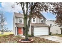 Two-story house with a two-car garage and a manicured lawn at 8115 Chesterhill Ln, Indianapolis, IN 46239