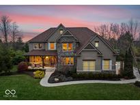 Two-story home with stone accents and a covered porch at 12164 Steepleview Ct, Fishers, IN 46037