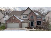 Two story house with a two car garage and landscaping at 12997 Bartlett Dr, Fishers, IN 46037