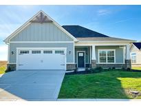 Charming one-story craftsman home with gray siding, white trim, and a two-car garage at 1684 Linden Ln, Greenfield, IN 46140