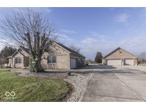 Brick house with attached garage and long driveway at 9048 N Watson Meadows Ln, Mooresville, IN 46158
