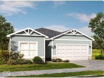 Charming single-story home with a two-car garage and landscaped front yard at 9913 Waterside Dr, Noblesville, IN 46064