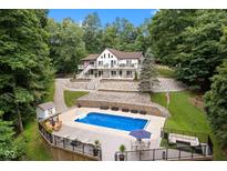 Inviting home with in-ground pool, nestled among lush trees at 7701 Center Lake Rd, Nineveh, IN 46164