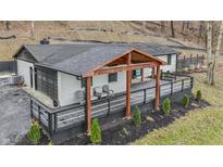 Charming updated home with a wooden covered porch and large deck at 1749 N Blue Bluff Rd, Martinsville, IN 46151