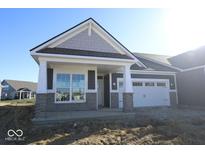 Front exterior of a two-story home with a covered porch and attached garage at 3509 Wrangler Dr, Bargersville, IN 46106