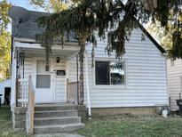 White house with steps and porch at 3919 E 34Th St, Indianapolis, IN 46218