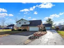 Charming two-story home with a two-car garage and driveway at 5621 Sugar Hills Dr, Greenfield, IN 46140