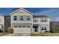 Two-story home with gray siding, black door and attached garage at 7056 E Mardenis N Dr, Camby, IN 46113