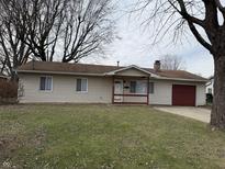 Ranch home with attached garage and landscaped lawn at 534 Mooreland Dr, Whiteland, IN 46184