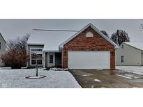 Brick ranch home with attached garage and snow-covered lawn at 6221 Boulder Dr, Anderson, IN 46013