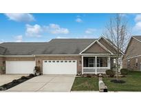 Brick ranch home with 2-car garage and front porch at 8623 Faulkner Dr, Indianapolis, IN 46239