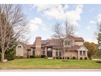 Brick house with a large front yard and solar panels at 4564 Bayberry Ln, Zionsville, IN 46077