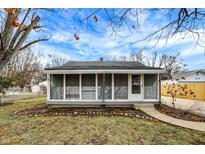 Charming one-story house with screened porch and landscaped yard at 4817 Welton St, Greenwood, IN 46143