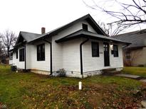 White house with black accents, steps, and a small lawn at 1314 Arrow Ave, Anderson, IN 46016