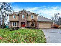 Two-story house with brick accents and a landscaped lawn at 11469 Woodview Ct, Fishers, IN 46038