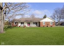 Brick ranch house with a large yard and mature trees at 3780 Cameron Ct, Anderson, IN 46012