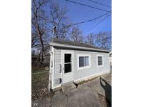 Gray siding house with a small yard at 1510 E Gimber St, Indianapolis, IN 46203