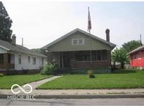 Charming bungalow with brick facade and a spacious lawn at 3953 English Ave, Indianapolis, IN 46201