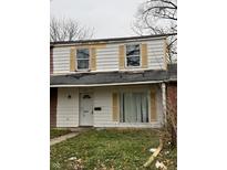 Two-story house with yellow shutters and a small front yard at 8434 Meadowlark Dr, Indianapolis, IN 46226