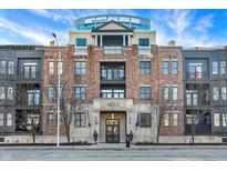 Brick building exterior, featuring multiple balconies and a grand entrance at 355 E Ohio E St # 324, Indianapolis, IN 46204