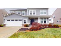 Two-story house with gray siding, white garage door, and landscaping at 1289 Vista Way, Greenwood, IN 46143