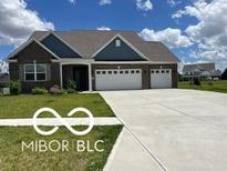 Brick 3-car garage home with landscaped lawn at 1753 Gordon Dr, Greenwood, IN 46143