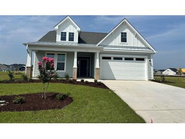 Charming two-story home with landscaping at 1228 Colusa Ct., Little River, SC 29566