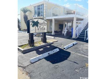 Palmetto Vista at Ocean Boulevard building exterior and parking at 2600 South Ocean Blvd. # 110, Myrtle Beach, SC 29577