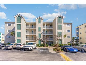 Three-story condo building with parking and landscaping at 1100 Commons Blvd. # 713, Myrtle Beach, SC 29572