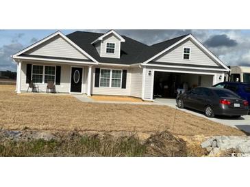 Single-story home with attached garage and landscaping at Tbd 6 Jamie Rd., Aynor, SC 29511