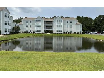 Apartment building with pond view in front at 2273 Huntingdon Dr. # J, Surfside Beach, SC 29575
