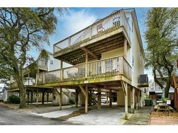 Elevated home with two levels of decks and parking underneath at 6001 South Kings Hwy., Myrtle Beach, SC 29575