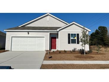 New single-story home with attached garage and landscaping at 1171 Flintshire Dr., Myrtle Beach, SC 29579