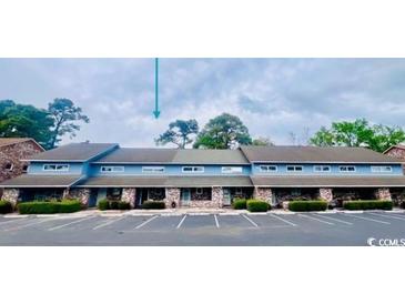 Front view of a light blue multi-unit building at 1840 Fairway Ridge Dr. # 8-F, Surfside Beach, SC 29575