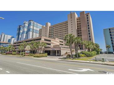 Sandcastle South Oceanfront resort building with parking and landscaping at 2207 S Ocean Blvd. # 1101, Myrtle Beach, SC 29577