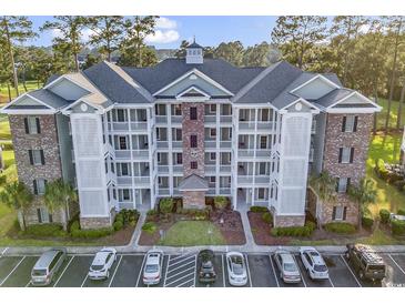 Brick building exterior with balconies and ample parking at 4874 Luster Leaf Circle # 304, Myrtle Beach, SC 29577