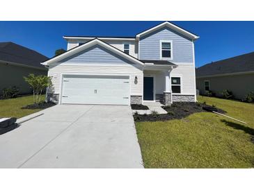 Two-story home with light blue and beige siding at 7089 Watercress St, Myrtle Beach, SC 29579
