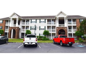 Brick apartment building with ample parking and landscaping at 3792 Hitchcock Way # 238, Myrtle Beach, SC 29577