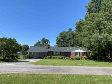 Brick ranch house with a spacious yard at 4155 Pinewood Dr., Mullins, SC 29574