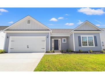 New construction home with gray siding, white accents, and a two-car garage at 3409 Little Bay Dr., Conway, SC 29526