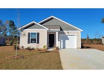 Charming one-story house with gray and beige siding, a white garage door, and a well-manicured lawn at 180 Country Grove Way, Galivants Ferry, SC 29544