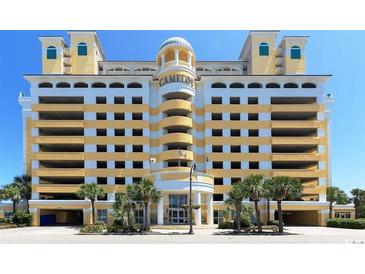 Impressive beachfront building with grand entrance, palm trees, and ample parking at 2000 N Ocean Blvd. # 1807, Myrtle Beach, SC 29577