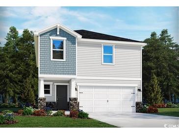 Two-story home with gray siding, a white garage door, and stone accents at 546 Cypress Preserve Circle, Longs, SC 29568