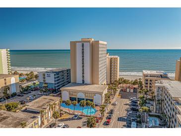 Aerial view of oceanfront property with parking and pool at 1207 S Ocean Blvd. # 51404, Myrtle Beach, SC 29577