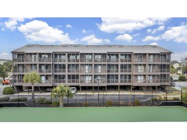 Exterior view of a beach condo building at 207 N Ocean Blvd. # 242, North Myrtle Beach, SC 29582